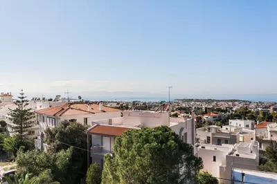 a view of a city with buildings at Sol Residence - Private Pool Gym Glyfada in Athens