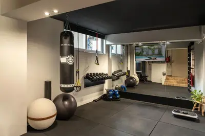 a room with a boxing gym with boxing equipment at Sol Residence - Private Pool Gym Glyfada in Athens