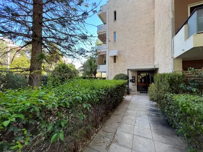 a walkway in front of a building at Charming apartment in Glyfada in Athens