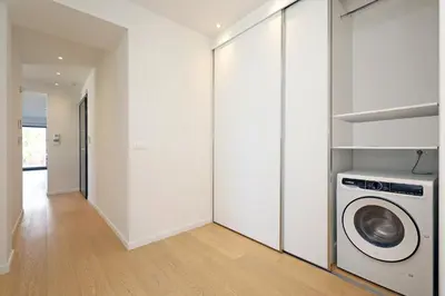 a laundry room with a washer and dryer at Ellinikon Luxury Apartment in Athens