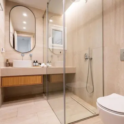 a bathroom with a shower and a sink and a toilet at 2-BD Luxury Apt Sea View Balcony near the beach in Athens