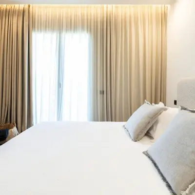 a bedroom with a white bed and a window at 2-BD Luxury Apt Sea View Balcony near the beach in Athens
