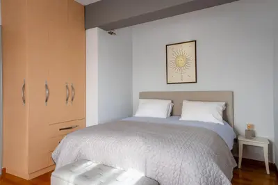 a bedroom with a large bed and a drawer at Porto Rafti Hideaway in Porto Rafti