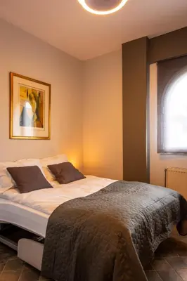 a bedroom with a bed and a window at Porto Rafti Hideaway in Porto Rafti