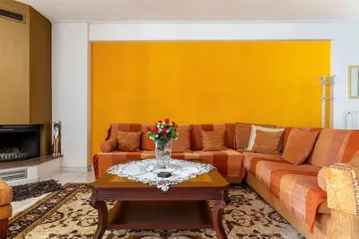 a living room with a couch and a table at Katerina's apartment in Athens