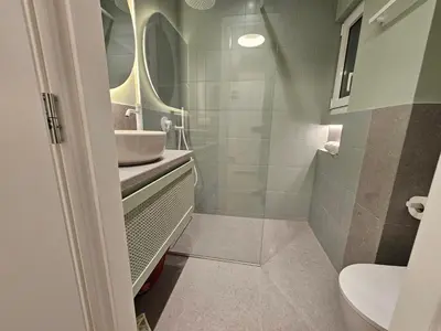 a bathroom with a sink and a toilet at Platon Stylish Apartment in Athens