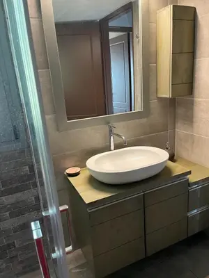 a bathroom with a sink and a mirror at Zinia House in Porto Rafti