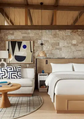 a bedroom with a bed and a couch at One&Only Aesthesis, Athens in Athens