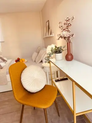 a room with a desk and a chair with a plate on it at Cactus Luxury suite1 in Athens