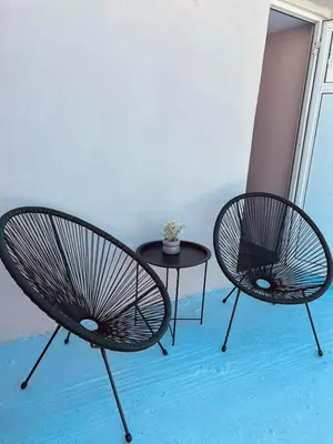 two chairs and a table in a room at Cactus Luxury suite1 in Athens