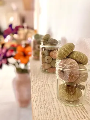 a table with two jars filled with pickles at 2 Bedroom, Sea Side Retreat Saronida in Saronida