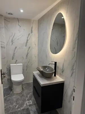 a bathroom with a sink and a mirror at 2 Bedroom, Sea Side Retreat Saronida in Saronida