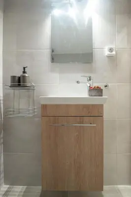 a bathroom with a sink and a mirror at Minimalistic! in Athens