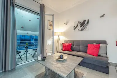 a living room with a couch and a table at Minimalistic! in Athens