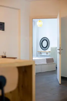 a room with a bed and a door to a bedroom at Silk Mill Metaxourgeio, Athens Centre in Athens