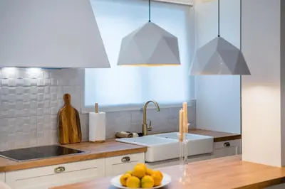 a kitchen with a sink and a plate of fruit at Zelda in Athens