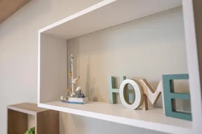 a shelf with a sign that says love on it at Nesto Athens Airport Den in Spáta