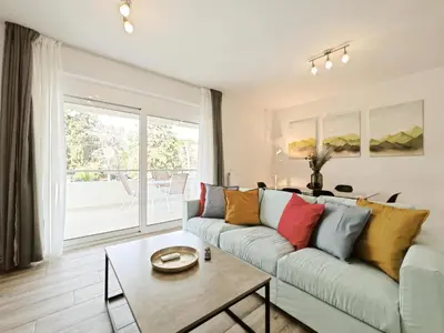 a living room with a couch and a table at Kapodistriou by Verde Apartments in Athens