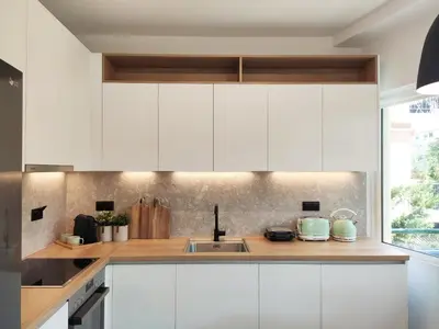 a kitchen with white cabinets and a sink at MINT - Modern apartment in the heart of Chalandri in Athens