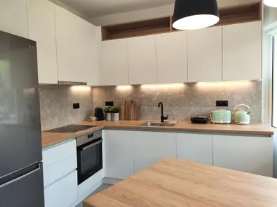 a kitchen with white cabinets and a sink at MINT - Modern apartment in the heart of Chalandri in Athens