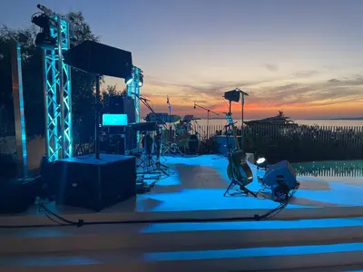 a set up for a concert with the sunset in the background at Seafront Athens Riviera Lagonisi Villa in Lagonissi