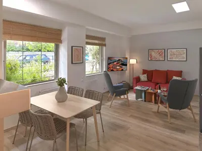 a living room with a couch and a table and chairs at Prime Location in Kolonaki A Luxurious 1BR Haven in Athens