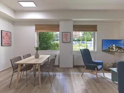 a dining room with a table and chairs in a room at Prime Location in Kolonaki A Luxurious 1BR Haven in Athens