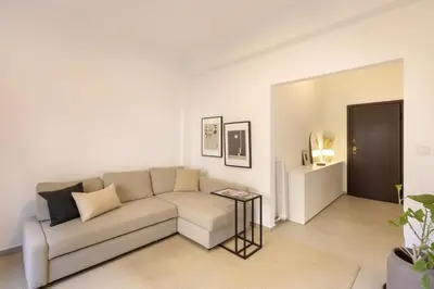 a living room with a couch and a table at Kerameikou25 large in Athens