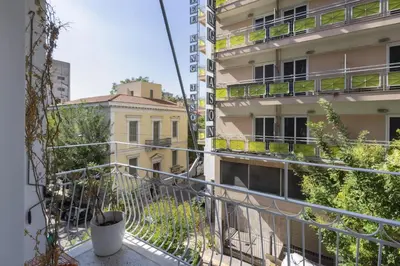 an apartment balcony with a view of buildings at Kerameikou25 small in Athens
