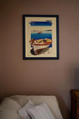 a picture of a boat hanging on a wall at Quiet Family apartment with Garden and Balconies in Athens
