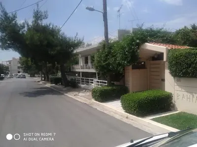 a house on the side of a street at Quiet Family apartment with Garden and Balconies in Athens