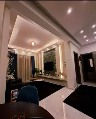 a living room with a couch and a television at Stay in Athens - muses in Athens