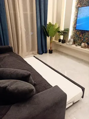 a living room with a couch and a flat screen tv at Stay in Athens - muses in Athens