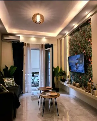 a living room with a couch and a table at Stay in Athens - muses in Athens