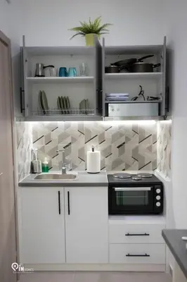 a kitchen with a sink and a microwave at The Mint - Stylish Studio in Egaleo-Athens in Athens