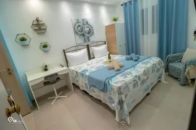 a bedroom with a bed with a teddy bear on it at The Aqua - Stylish & Comfy Studio in Egaleo-Athens in Athens