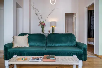 a green couch in a living room with a coffee table at Pistachio in Athens