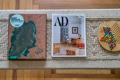 a book and a magazine sitting on top of a table at Pistachio in Athens