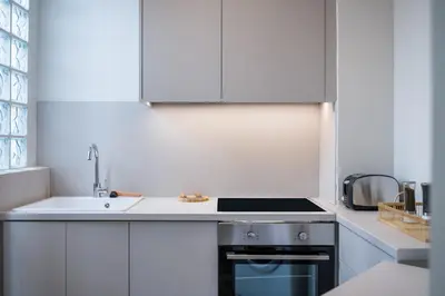 a small kitchen with a sink and a stove at Pistachio in Athens
