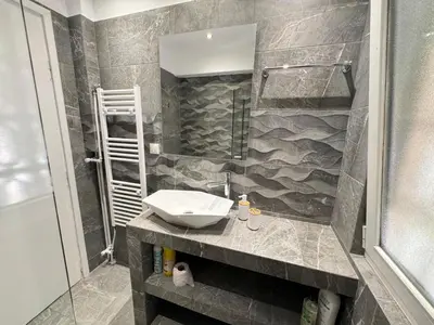 a bathroom with a sink and a shower at South coast -- AL020 in Athens