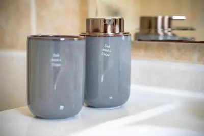 two blue cups sitting on a counter next to a sink at Koropi 3 bedroom Luxurious Apartment 5 pers- Angel House in Koropíon