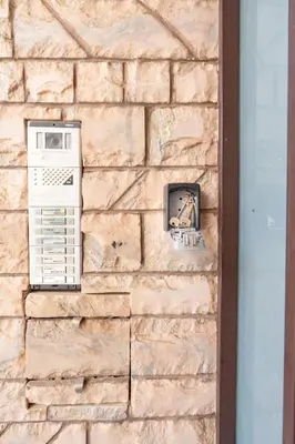 a brick wall with a computer on it at Koropi 3 bedroom Luxurious Apartment 5 pers- Angel House in Koropíon