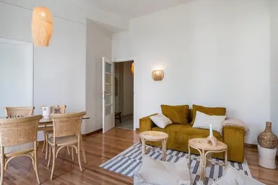 a living room with a couch and a table at Honey in Athens