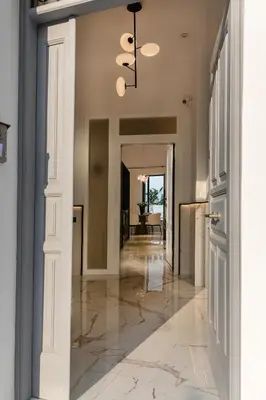 a hallway of a home with a ceiling fan at Maison 36 Villa in the center of Psyri in Athens