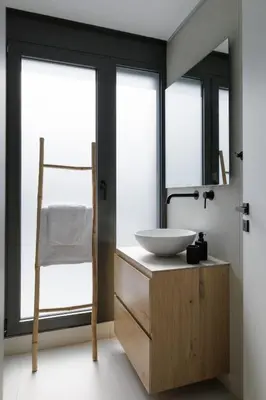 a bathroom with a sink and a mirror at Experience Penthouse by Athens Riviera Suites in Saronida