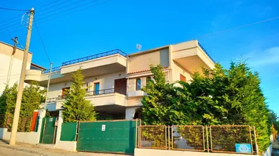 a house with a fence in front of it at Spata sunrise house in Spáta