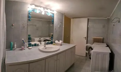 a bathroom with a sink and a mirror at Spata sunrise house in Spáta