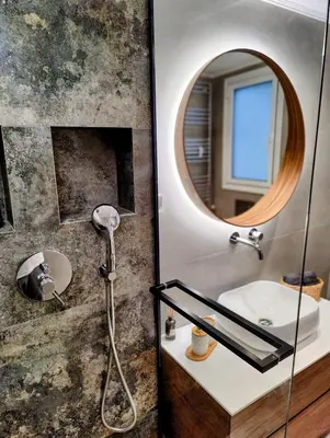 a bathroom with a sink and a mirror at Elpis' cozy & luxury apartment in Athens