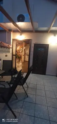 a room with two chairs and a door in a building at Angi&George house in Athens