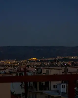 a view of a city at night at Angi&George house in Athens